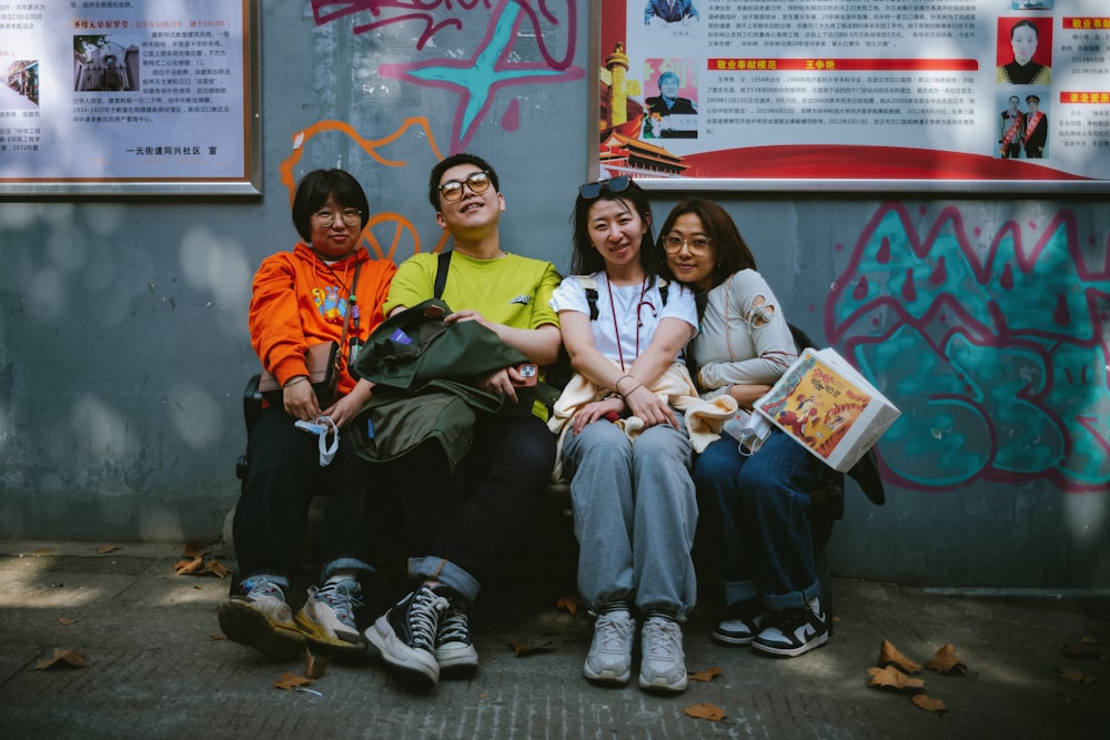 a group of people sitting next to each other