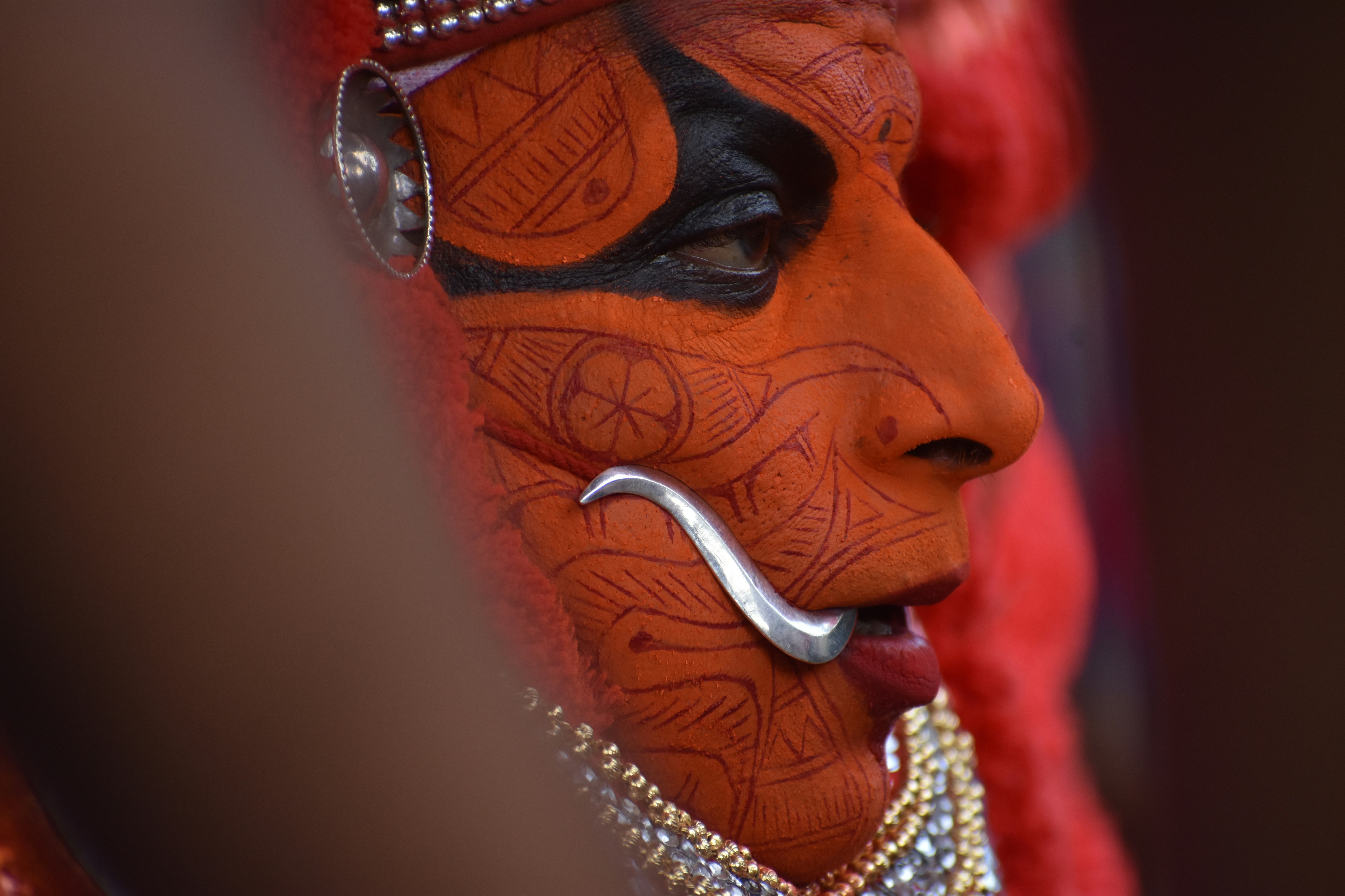 a man with a painted face and nose