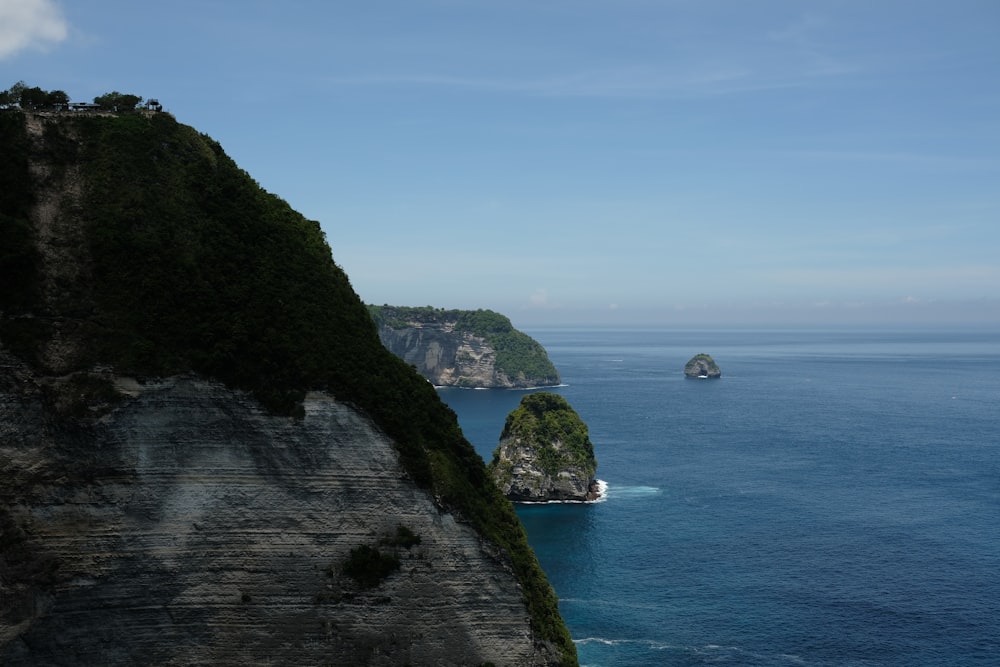 a large body of water next to a cliff