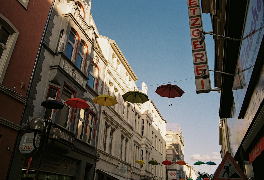 a city street filled with lots of umbrellas