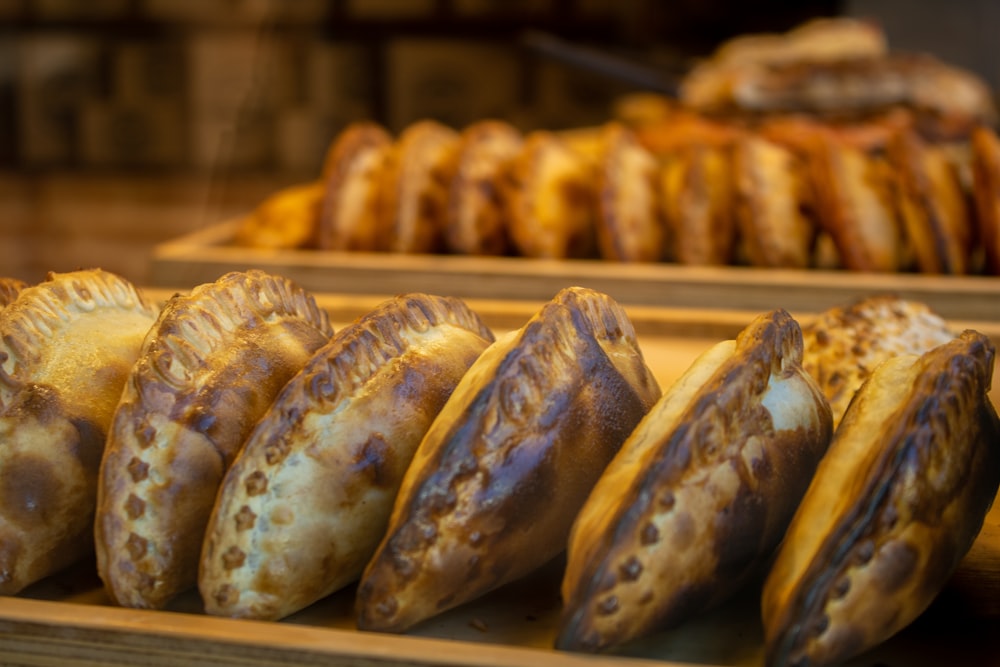 a bunch of pastries that are on a shelf