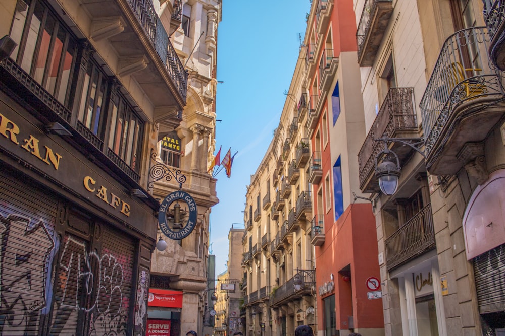 a narrow city street lined with tall buildings