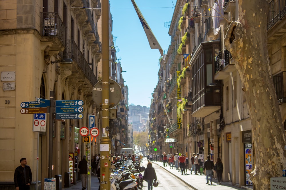 a city street filled with lots of tall buildings