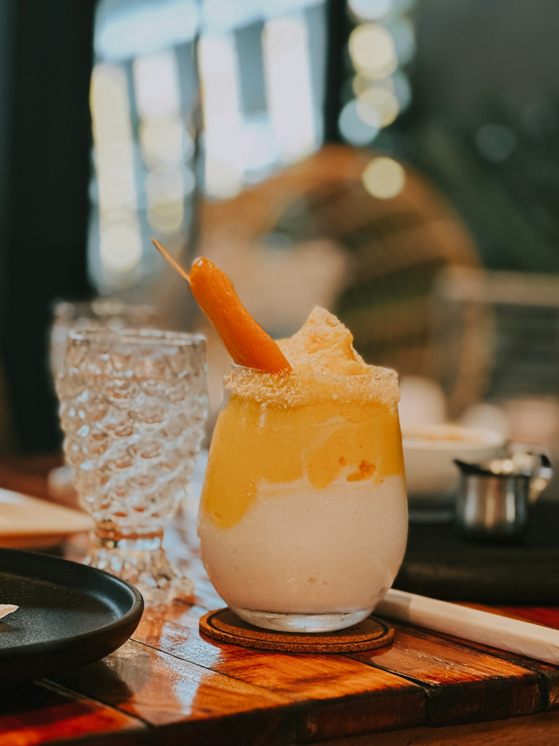 a drink with a carrot sticking out of it