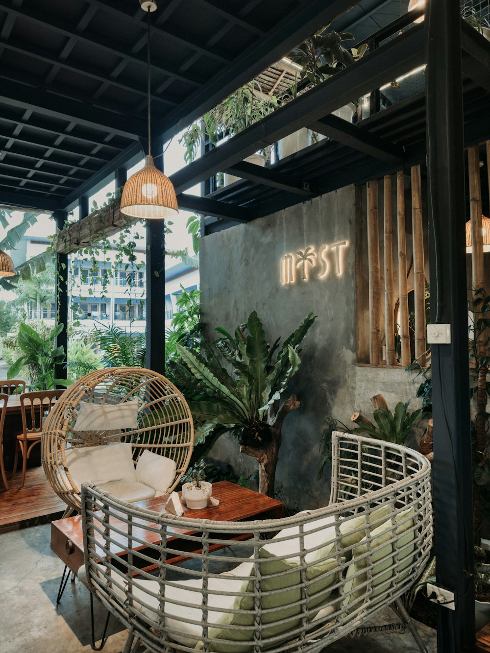 a room filled with lots of furniture and plants