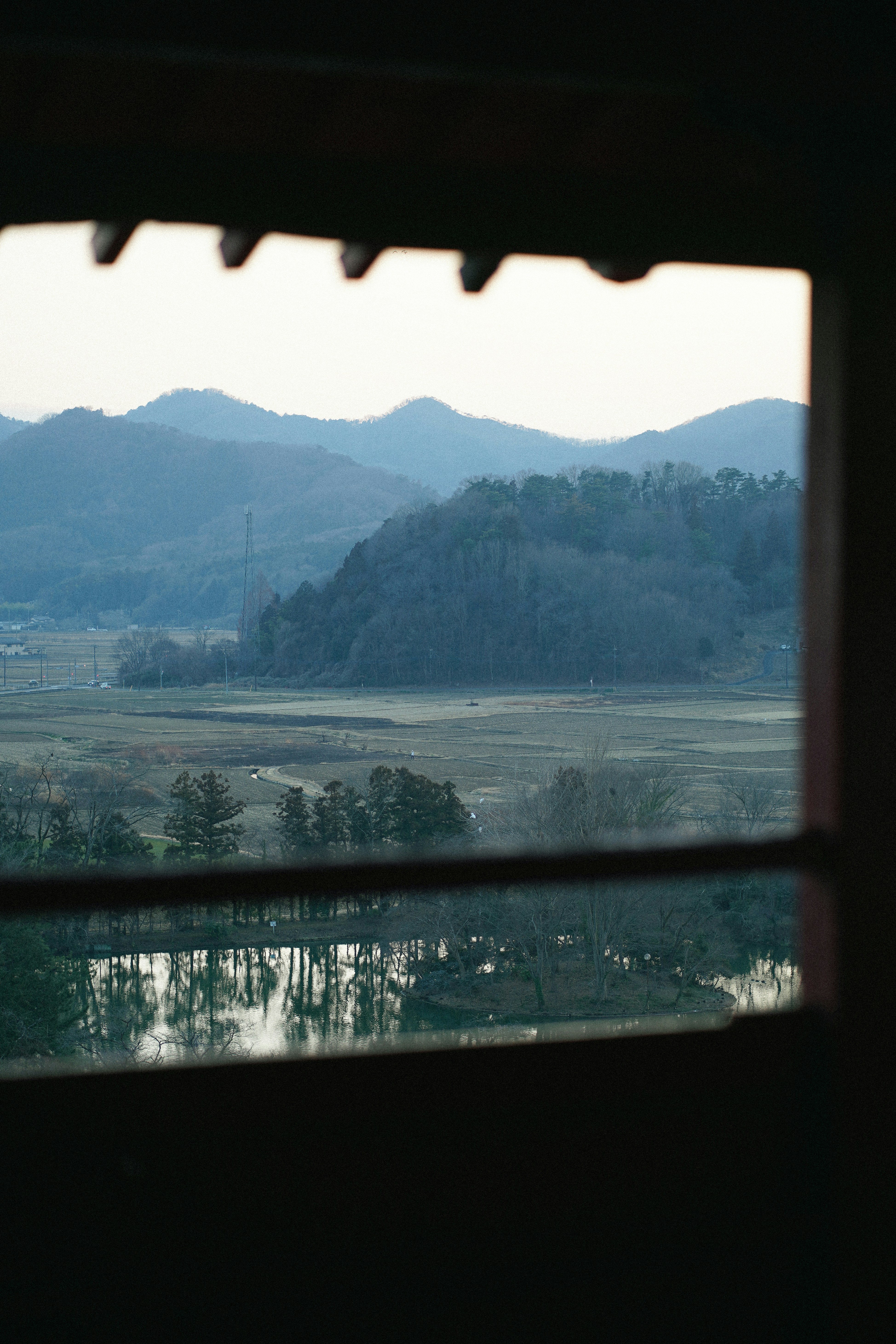 a view of a mountain range through a window