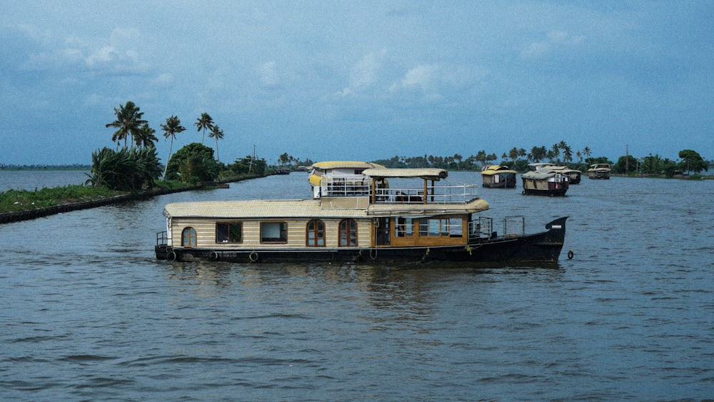 a house boat floating on top of a river