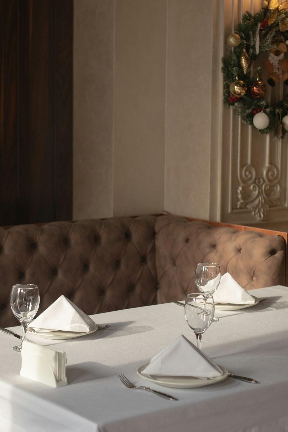 a table with a white table cloth and place settings