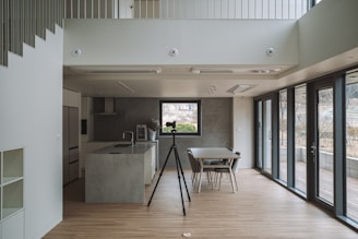 a kitchen with a table and chairs in it