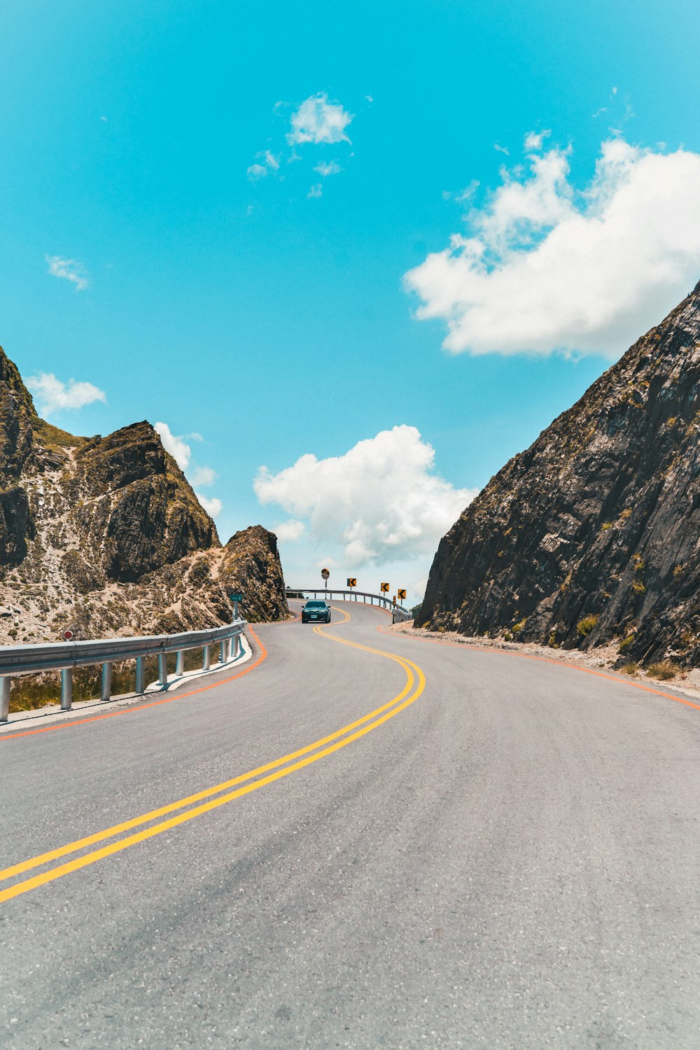 a view of a road with a mountain in the background