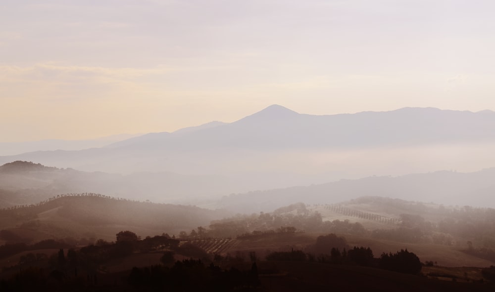 a view of a foggy mountain range