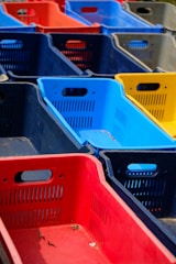 a row of plastic bins sitting next to each other