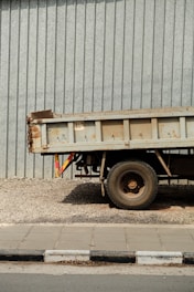 a dump truck parked in front of a building