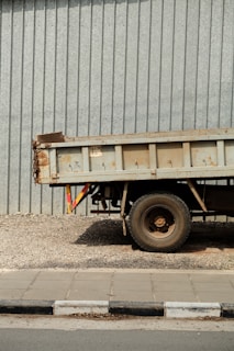 a dump truck parked in front of a building