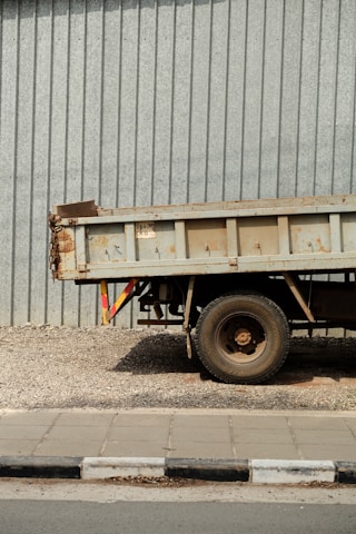 a dump truck parked in front of a building