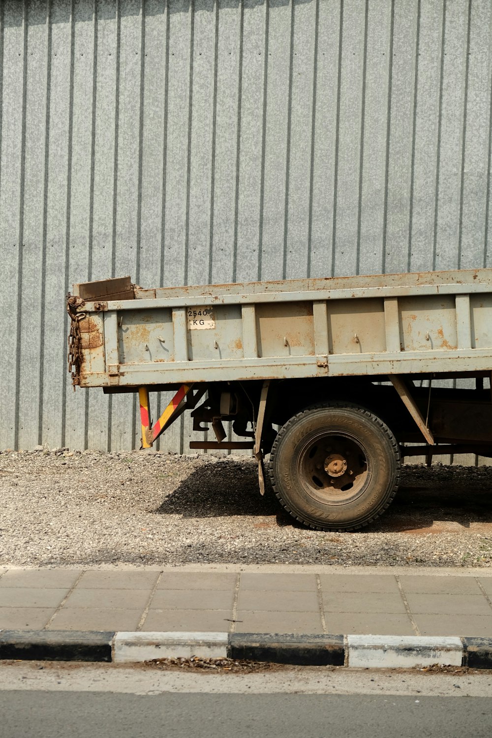 a dump truck parked in front of a building