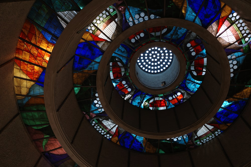 a circular stained glass window in a building