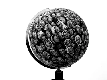 Illustration of a globe wrapped in manga panels symbolizing global peace and storytelling.