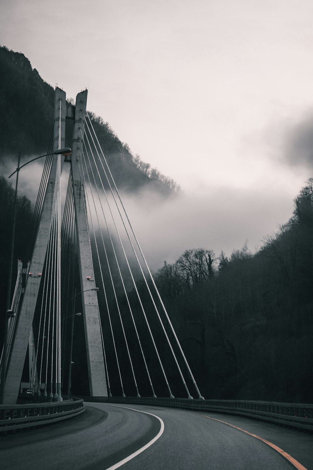 a very tall bridge spanning over a road