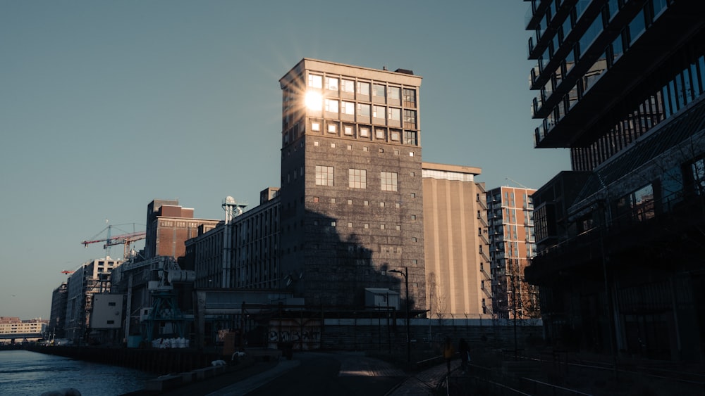 the sun shines through the windows of a tall building