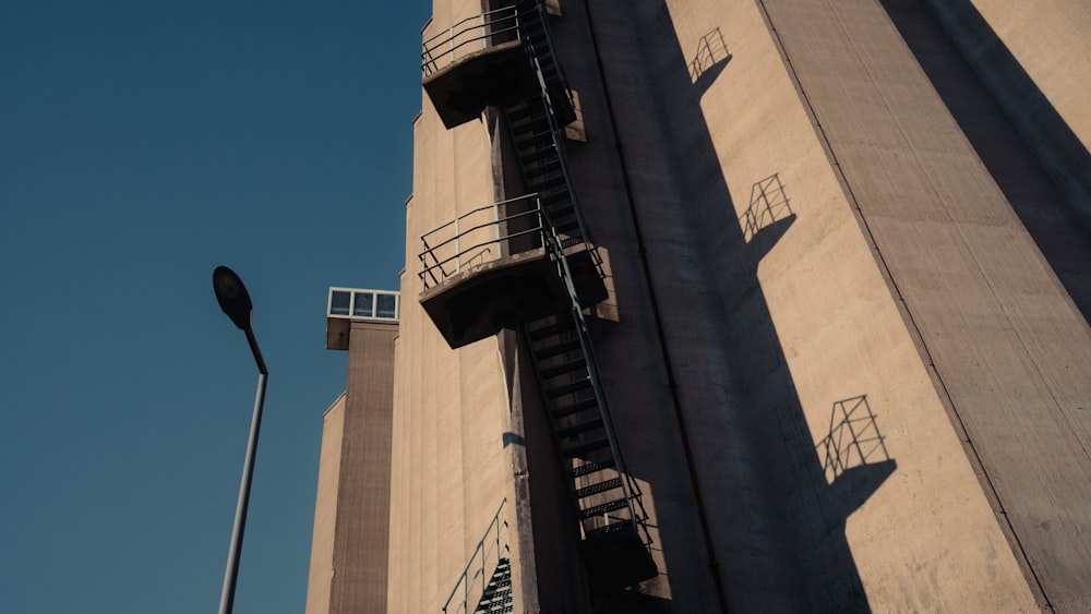 a tall building with a street light next to it