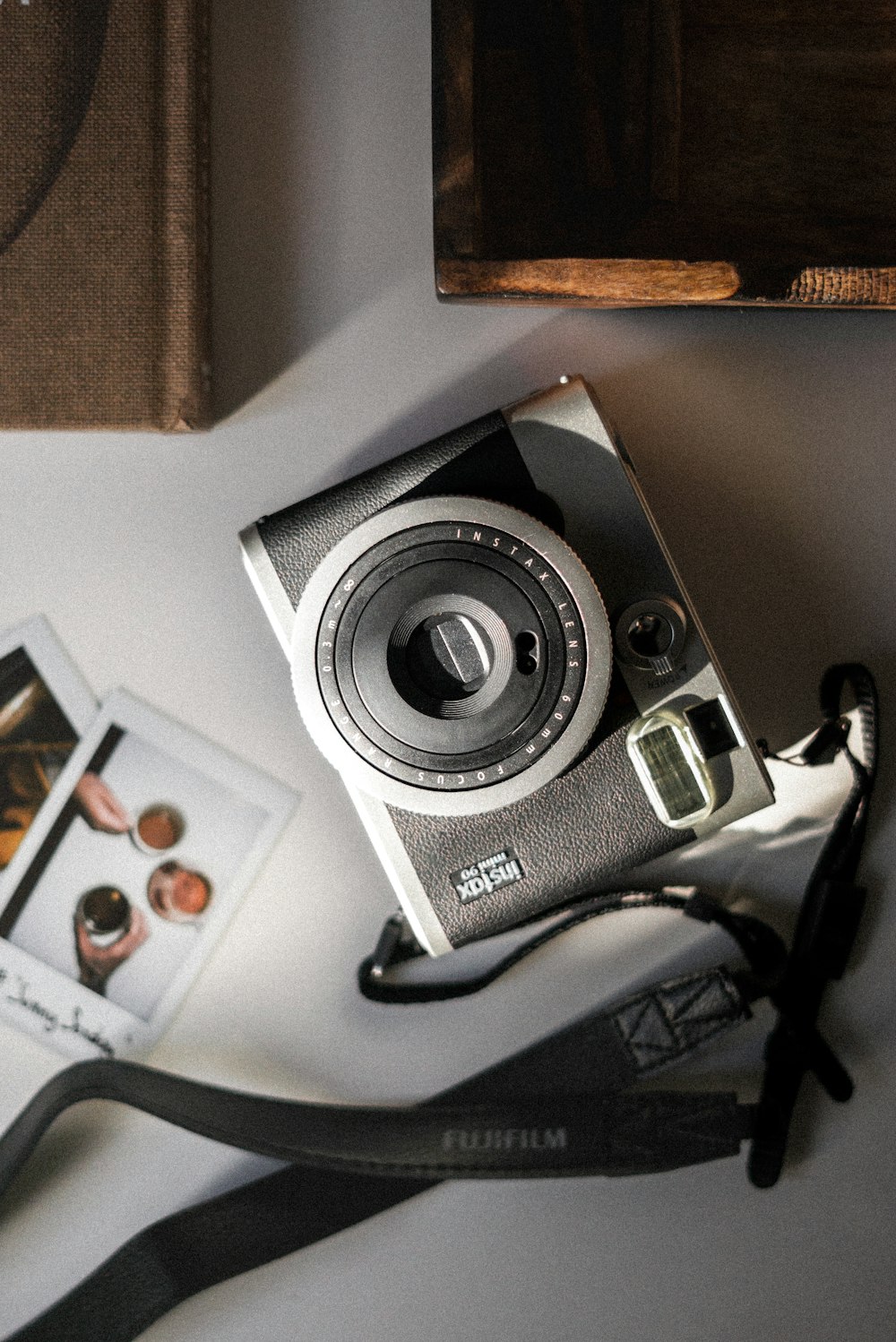 a camera sitting on top of a table next to a pair of scissors