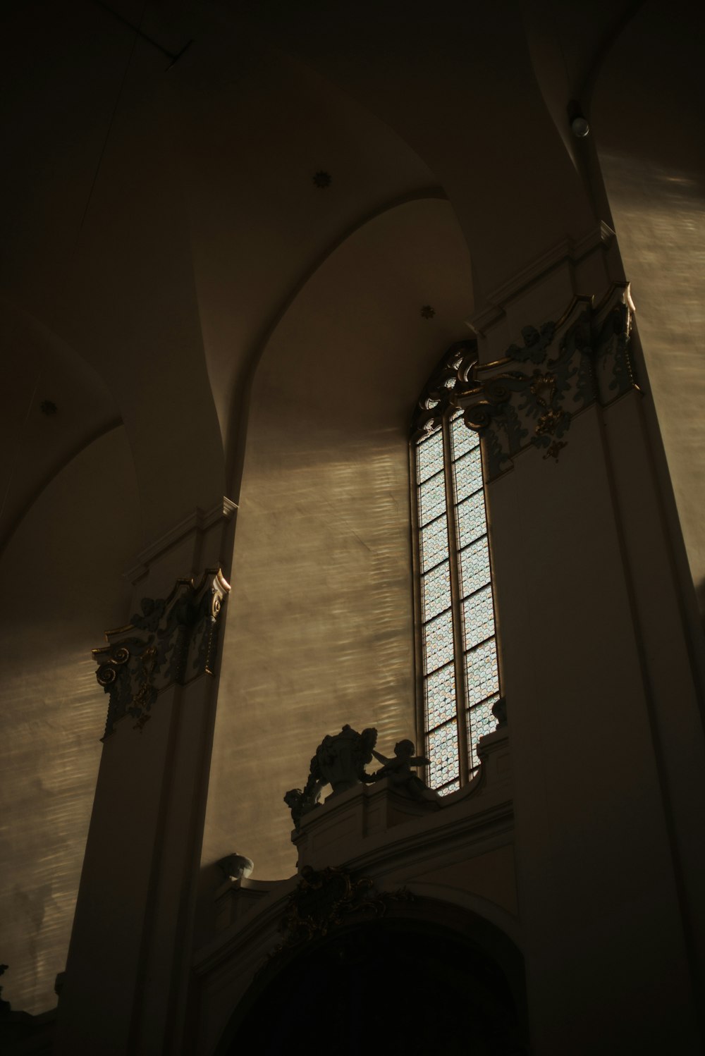 a window in a building with a light coming through it