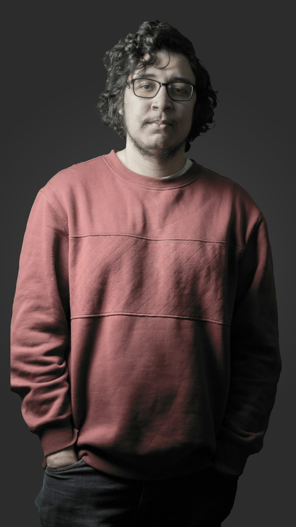 a man in a red sweater and glasses