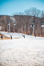 A ski instructor teaching a student on a snowy slope.