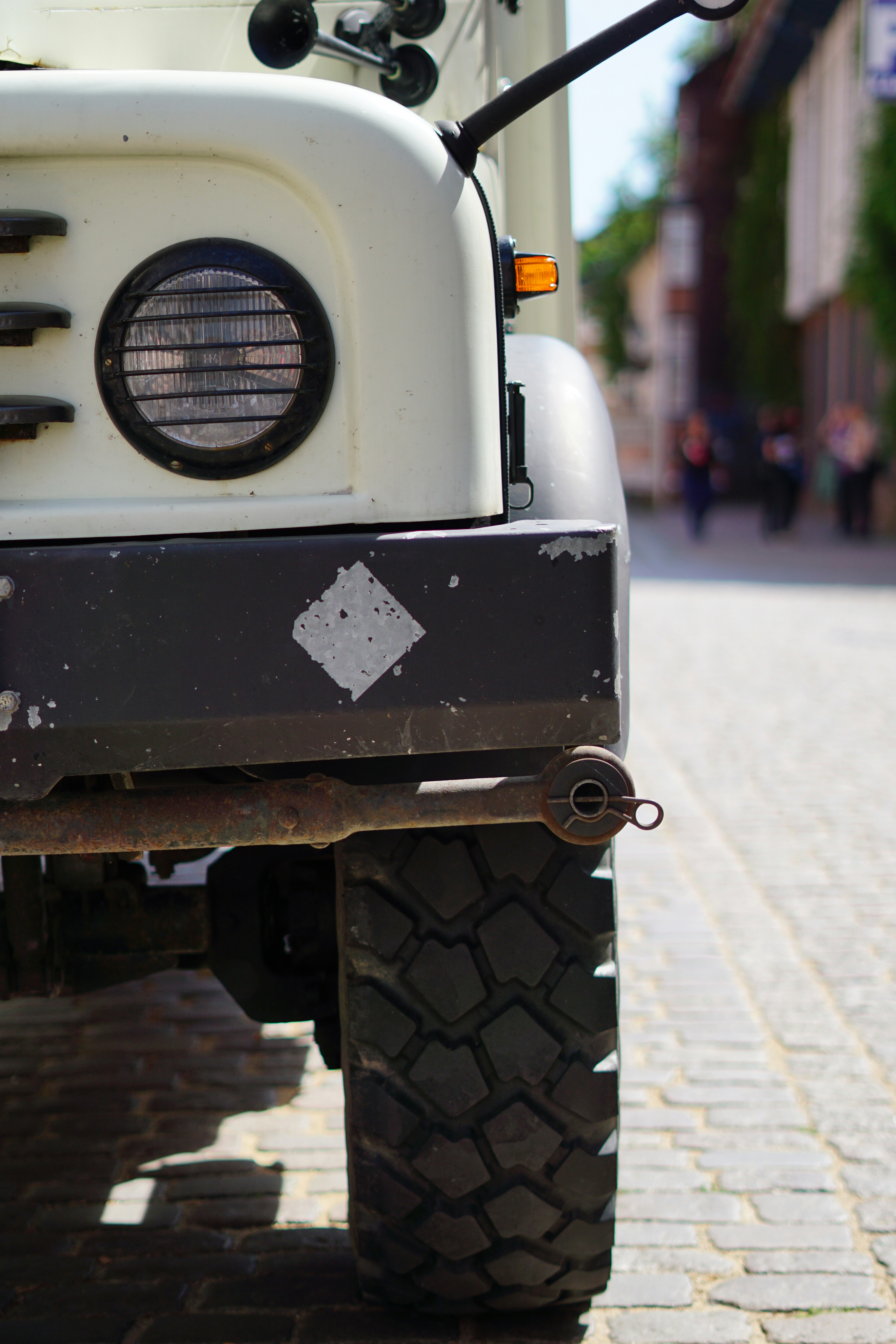 a white truck parked on the side of a road