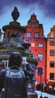 Traveler taking photos of iconic landmarks during a personalized Flavio Travel itinerary.
