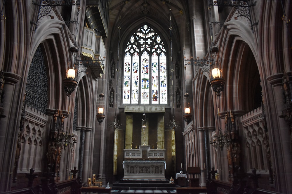 a large cathedral with a bench in the middle of it