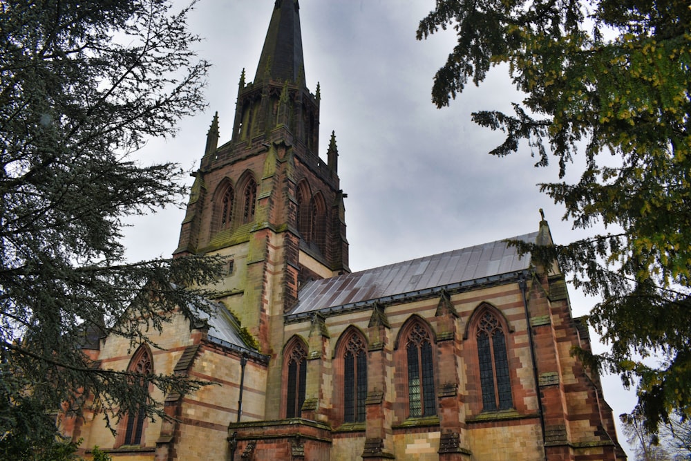 an old church with a steeple and a clock tower