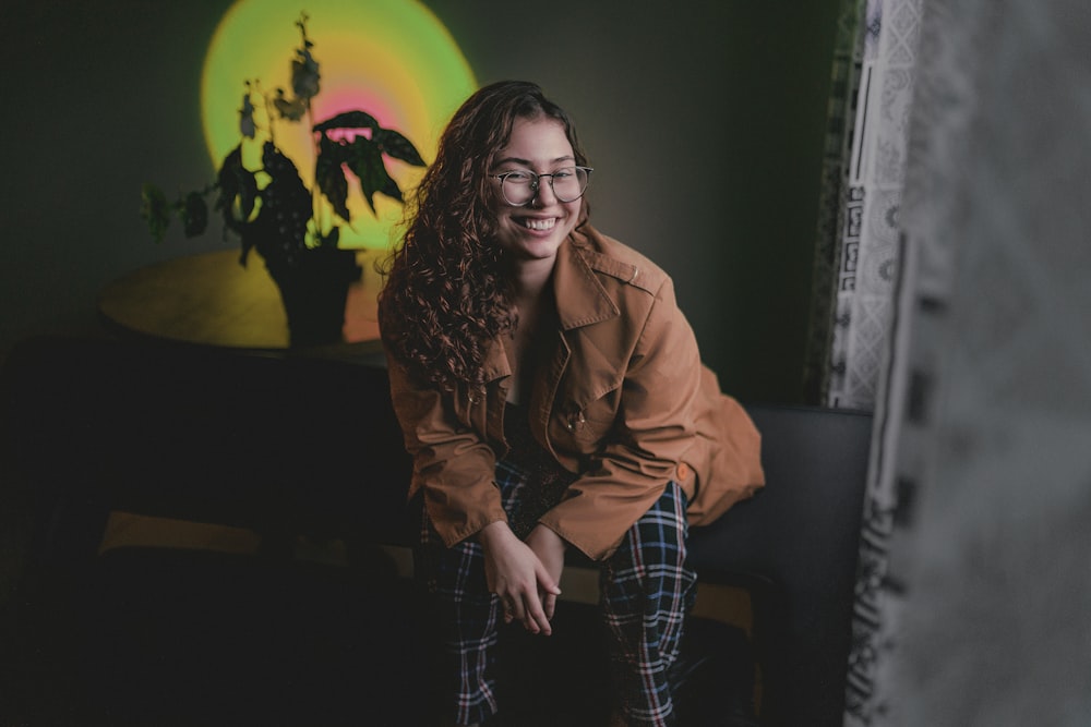 a woman sitting on a couch in a room