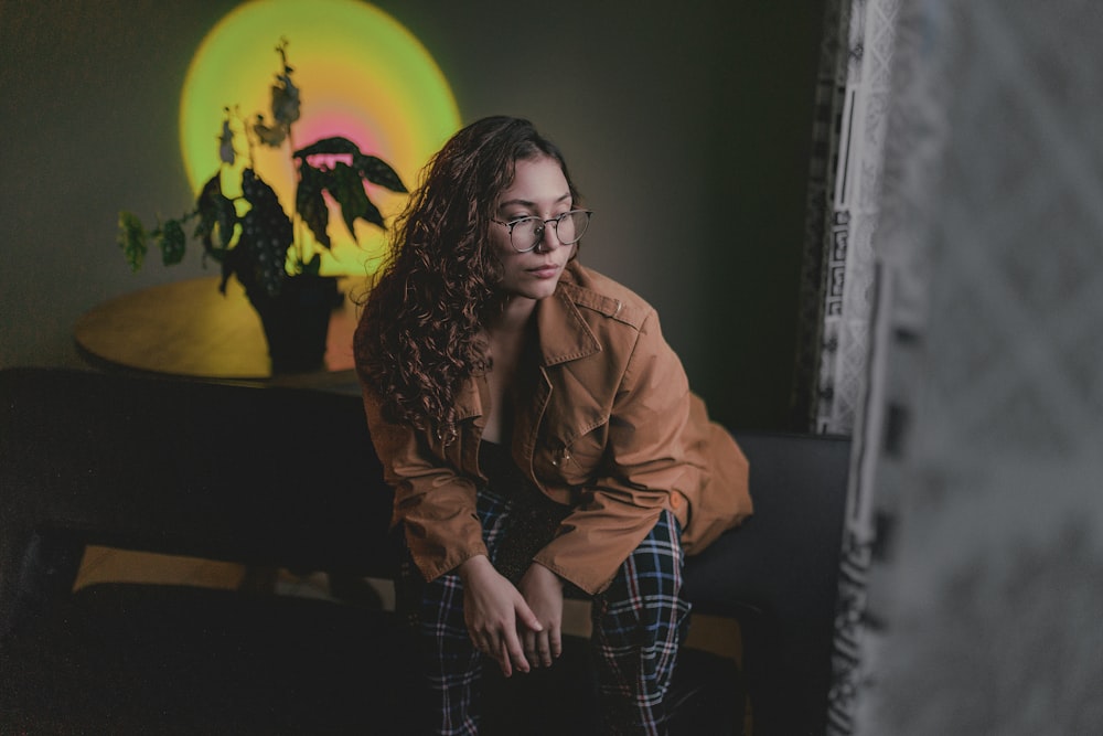 a woman sitting on a chair in a room