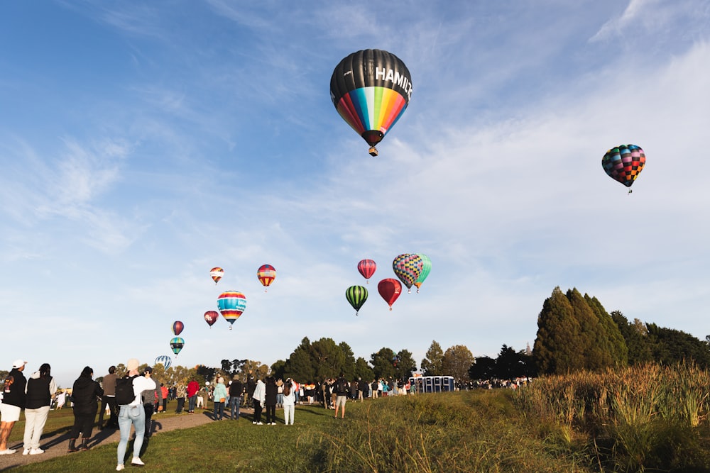 a bunch of hot air balloons flying in the sky