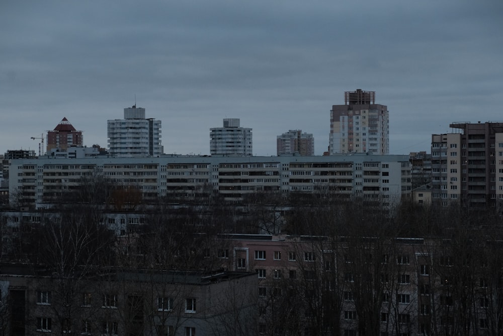 a city skyline with tall buildings in the background