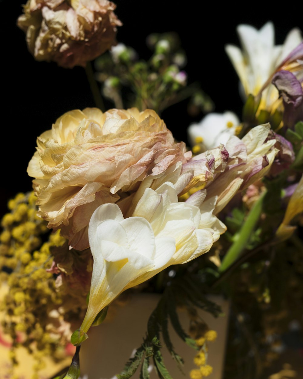 a bunch of flowers that are in a vase