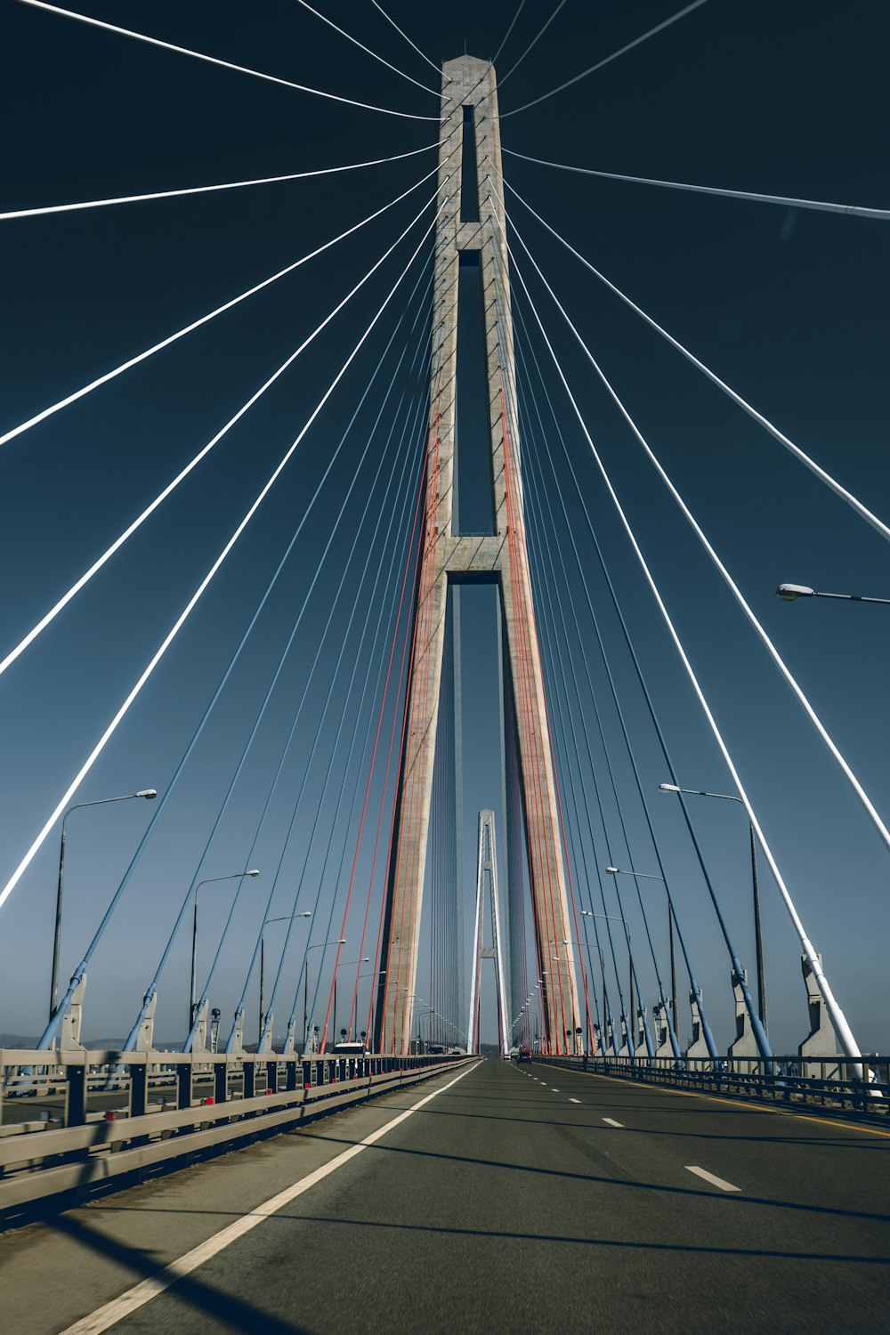 a view of a very tall bridge from a car