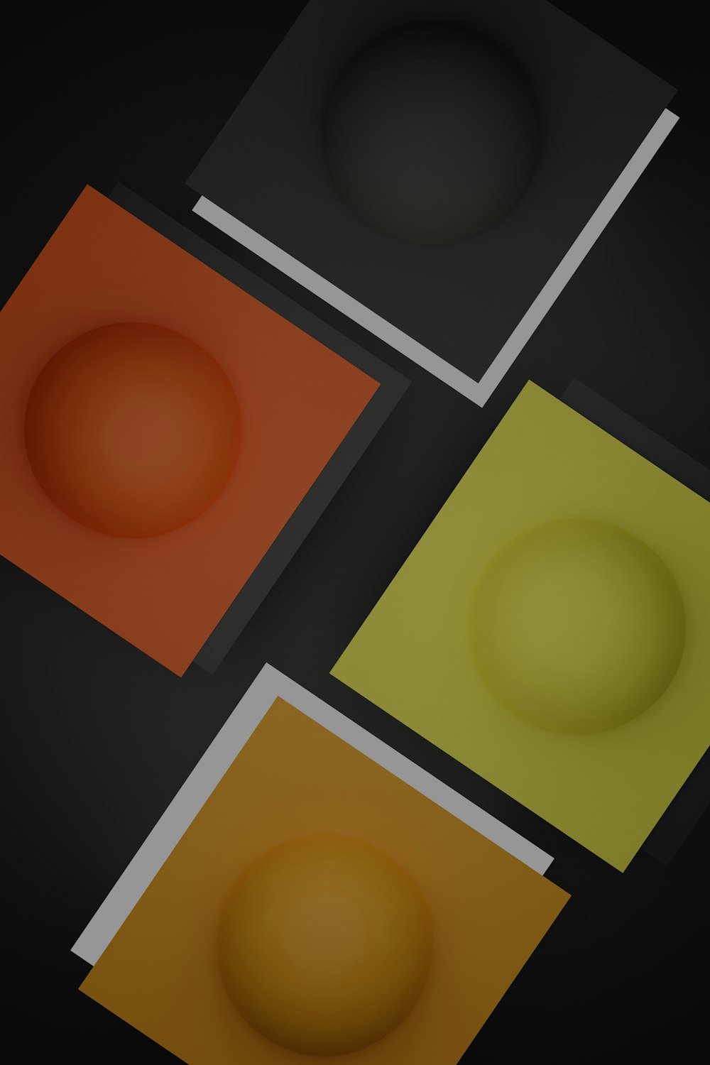 a group of three different colored squares on a black background