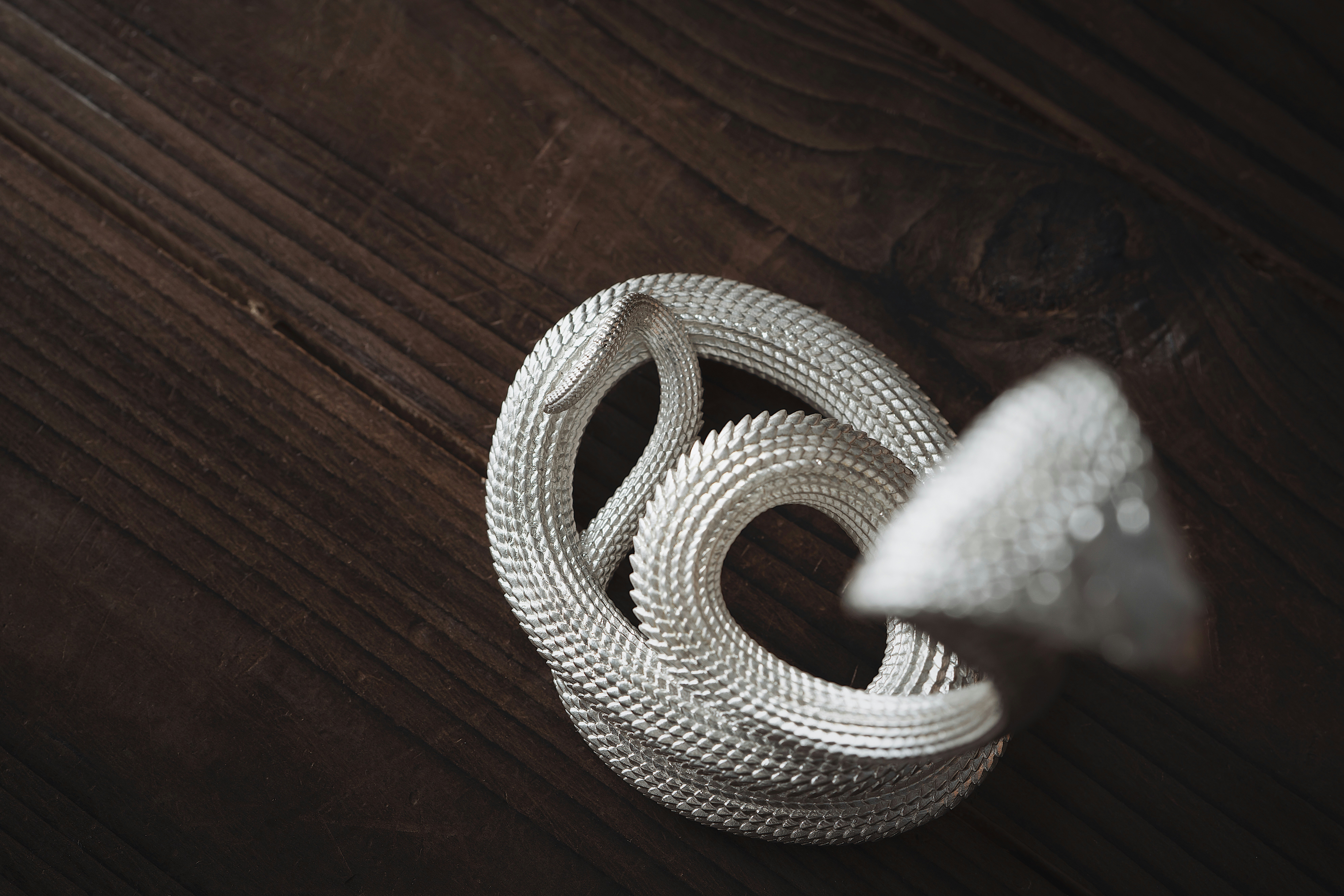 a white object sitting on top of a wooden table