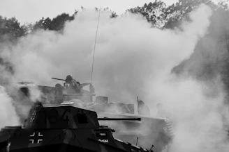 Historic image of tanks rolling through a European village.