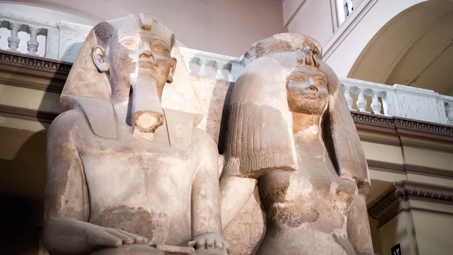 Statues of pharaohs displayed in the Grand Egyptian Museum's main galleries