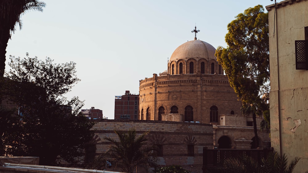 a large building with a cross on top of it