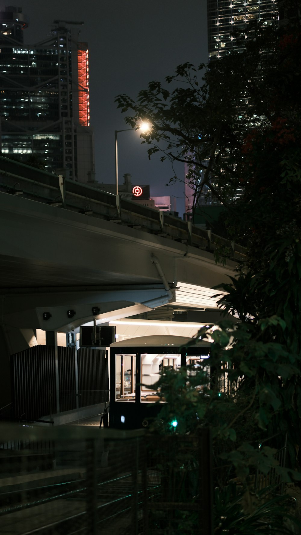 a night view of a city with tall buildings