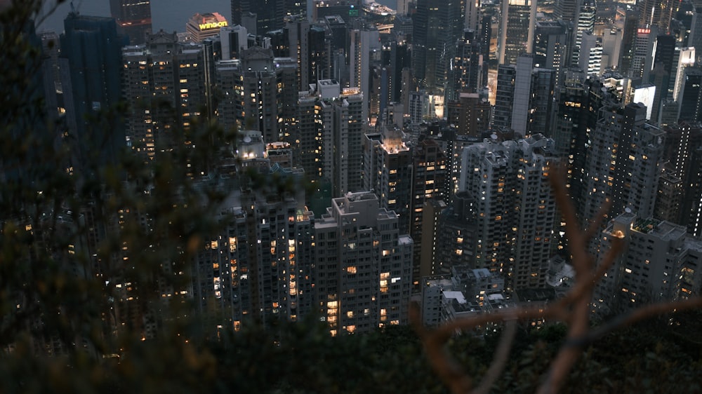 a view of a city at night from the top of a hill