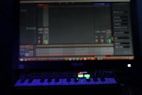 a keyboard sitting in front of a computer monitor