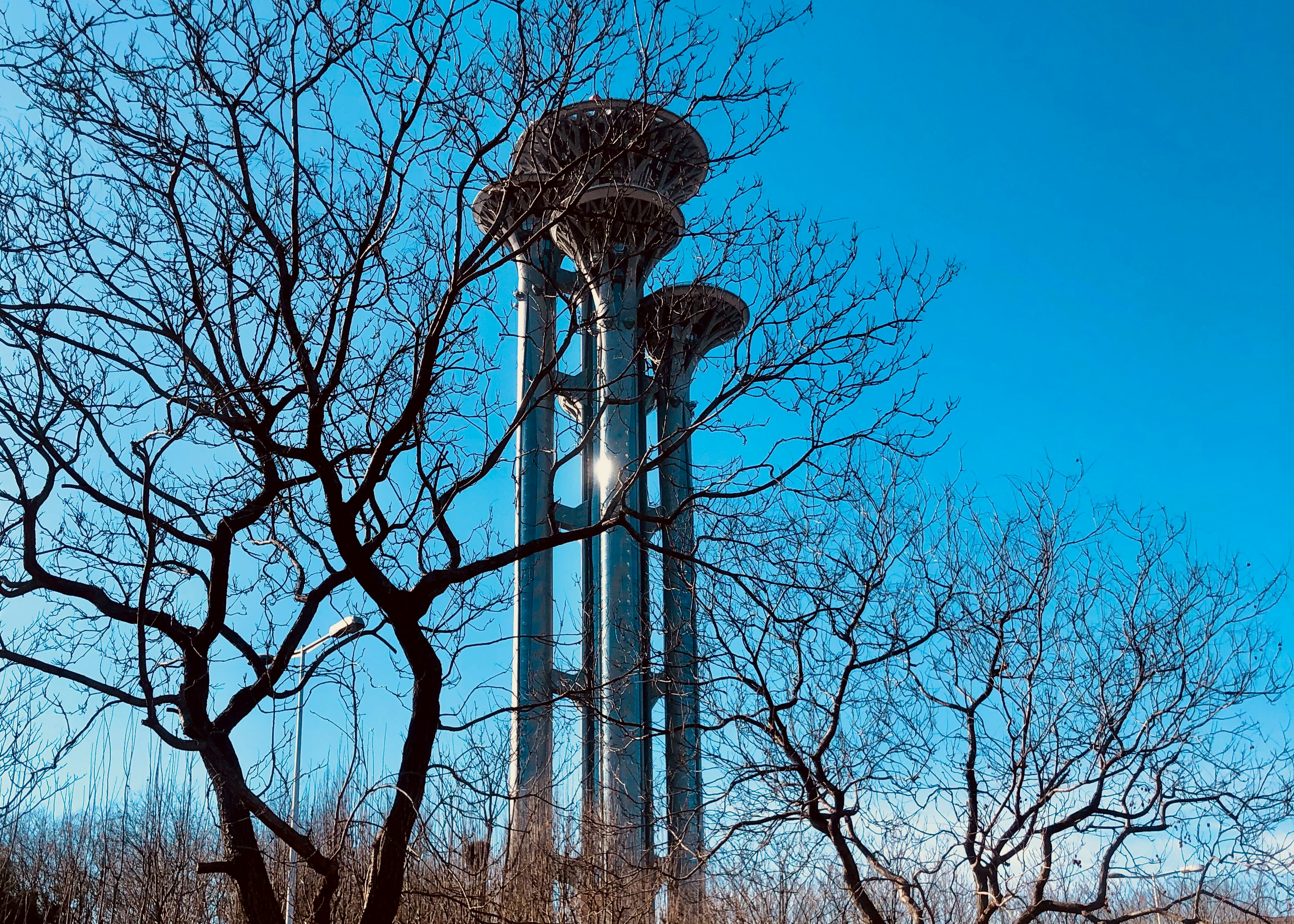 a tall tower with a clock on the top of it