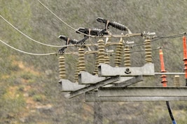 a bunch of wires that are on top of a pole