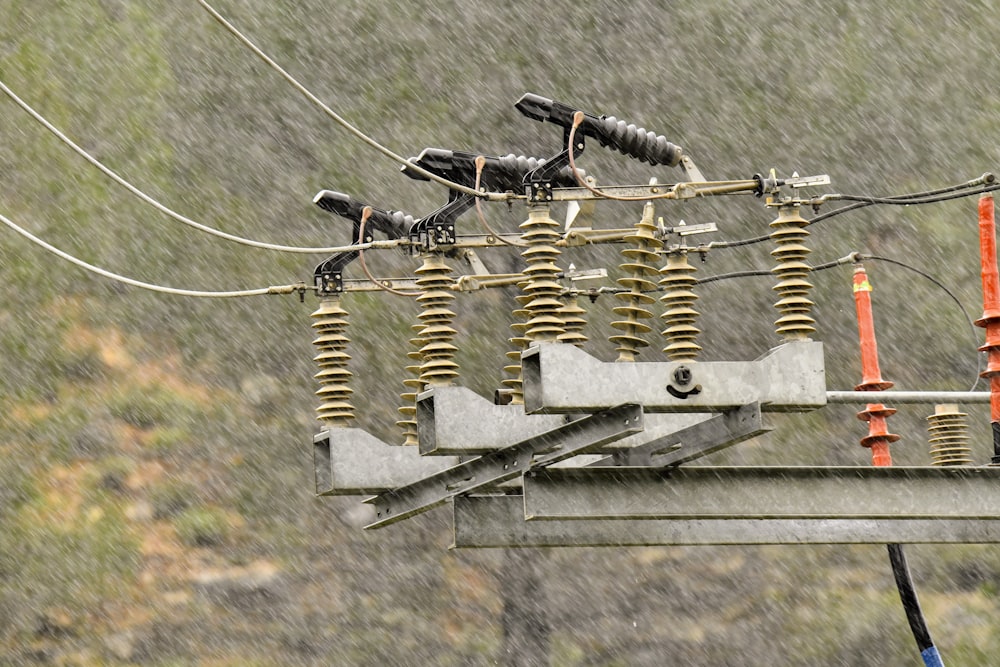 a bunch of wires that are on top of a pole